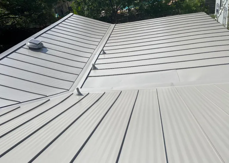 Solar attic fan installed on a metal roof for Roof Ventilation in Wyoming